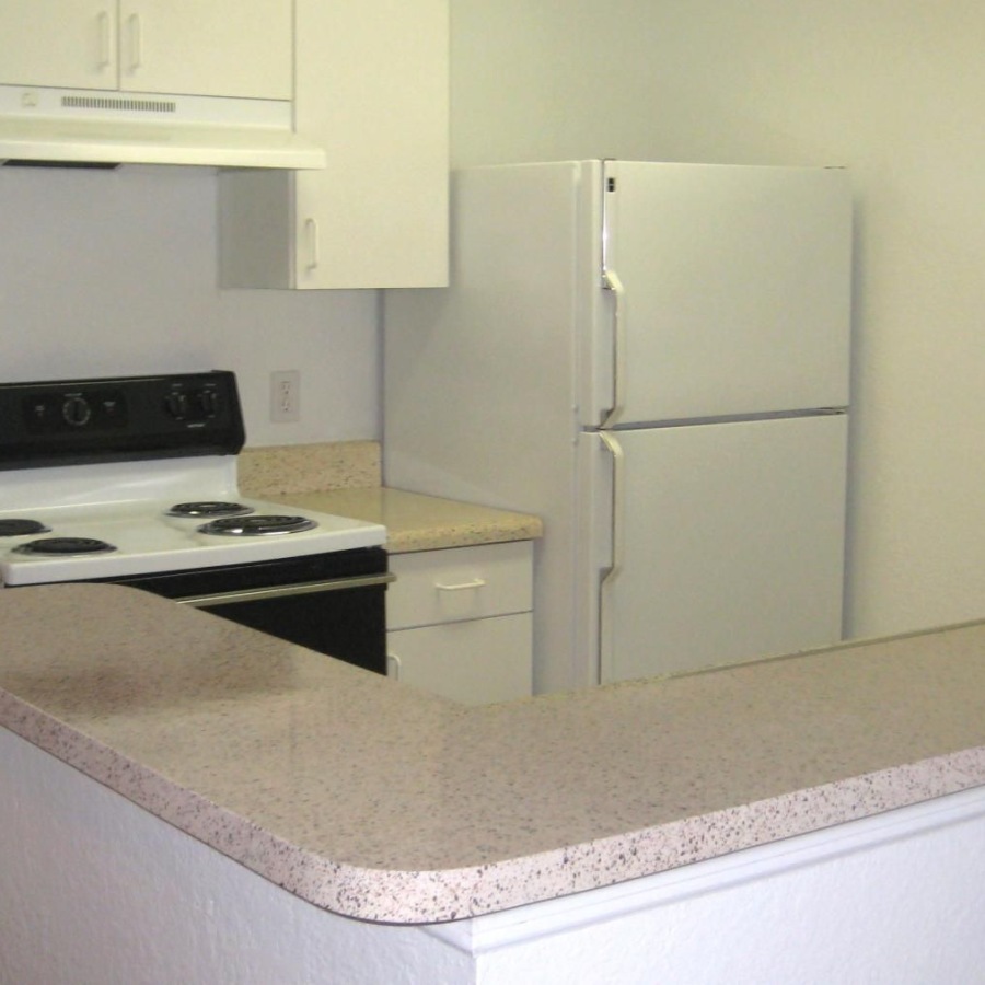 a kitchen with white cabinets